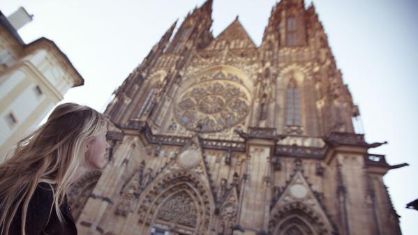 couple looking at camera in streets of prague, czech republic